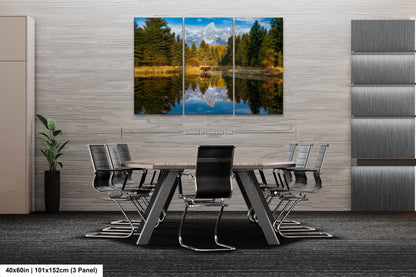 a dining room table with chairs and a painting on the wall
