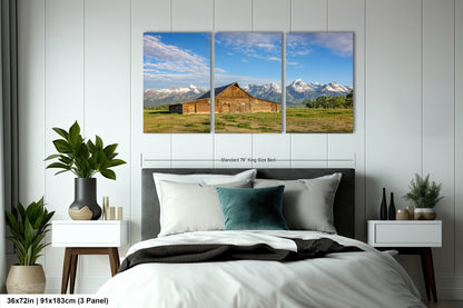 a bed room with a neatly made bed and two pictures on the wall
