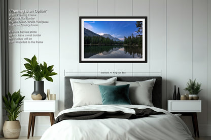 a bedroom with a large bed and a picture on the wall