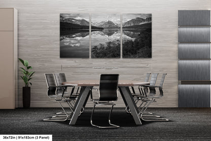 a black and white photo of a table and chairs