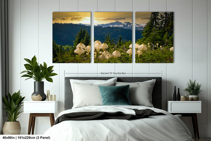 a bedroom scene with a bed and two paintings on the wall