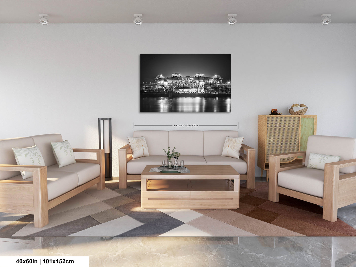 a living room filled with furniture and a painting on the wall