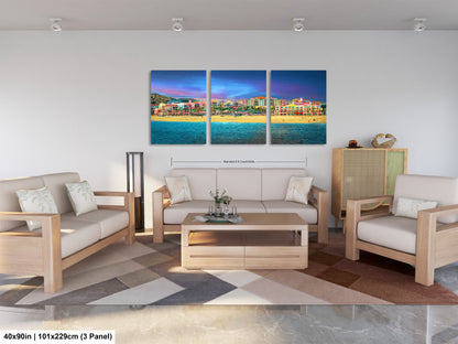 a living room filled with furniture and a painting on the wall