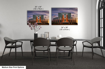 a dining room table with chairs and a vase of flowers