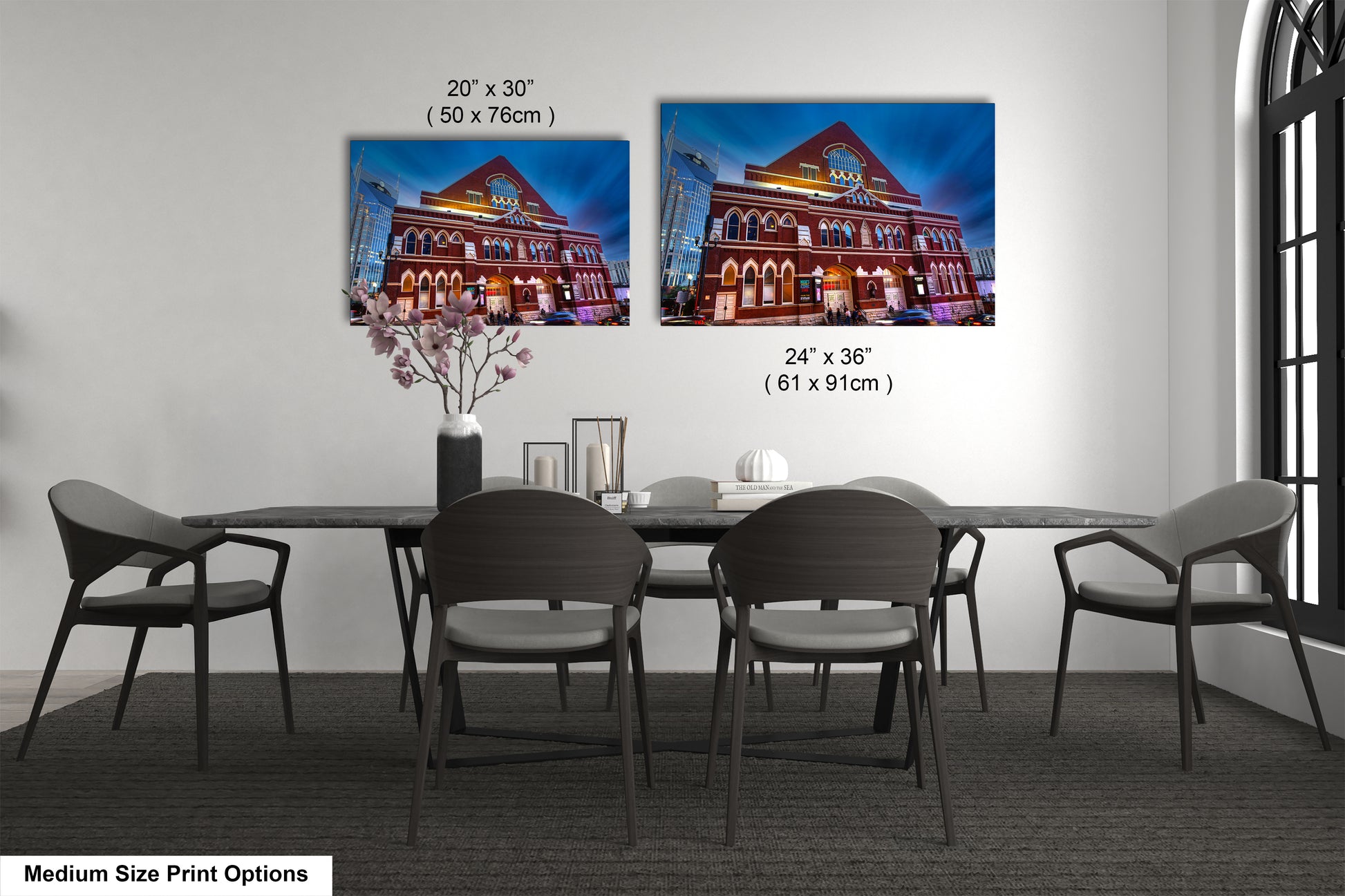 a dining table with four chairs and a vase of flowers