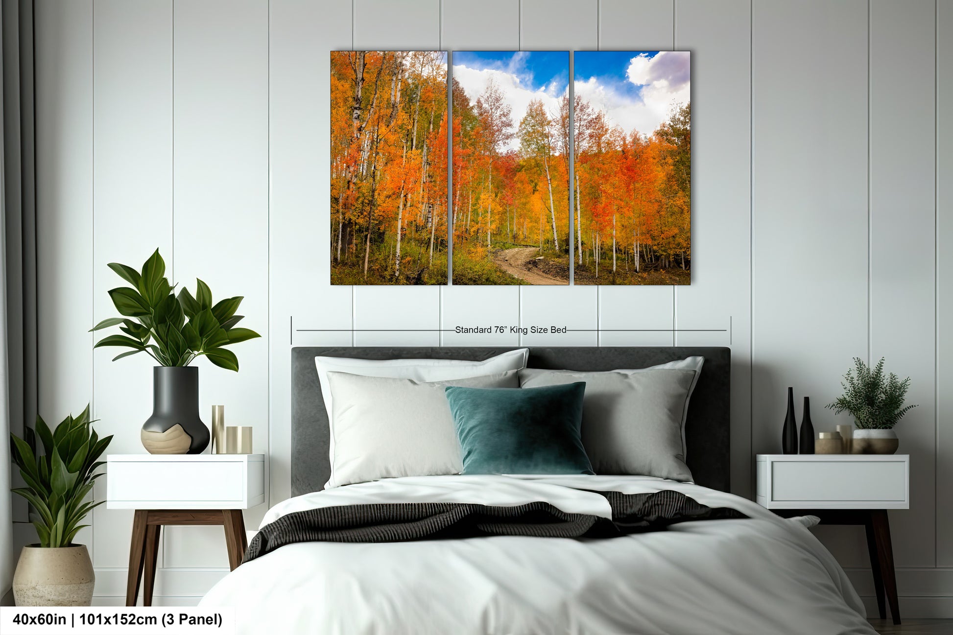 a bed room with a neatly made bed and a painting on the wall