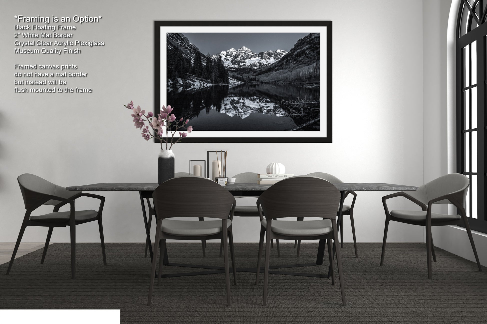 a black and white photo of a table and chairs