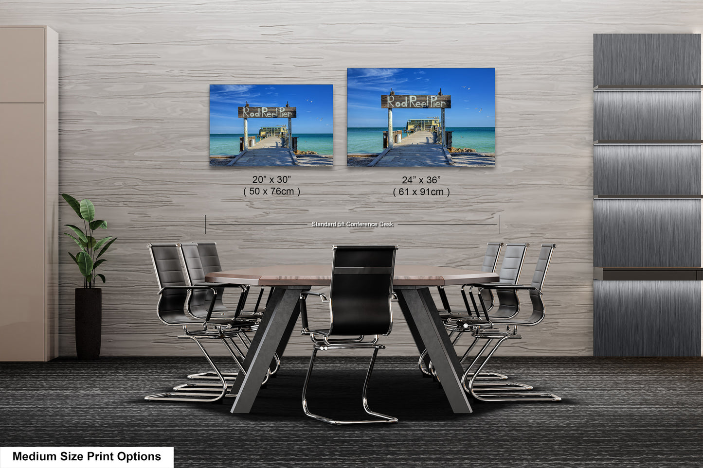 a dining room table with chairs and two pictures on the wall