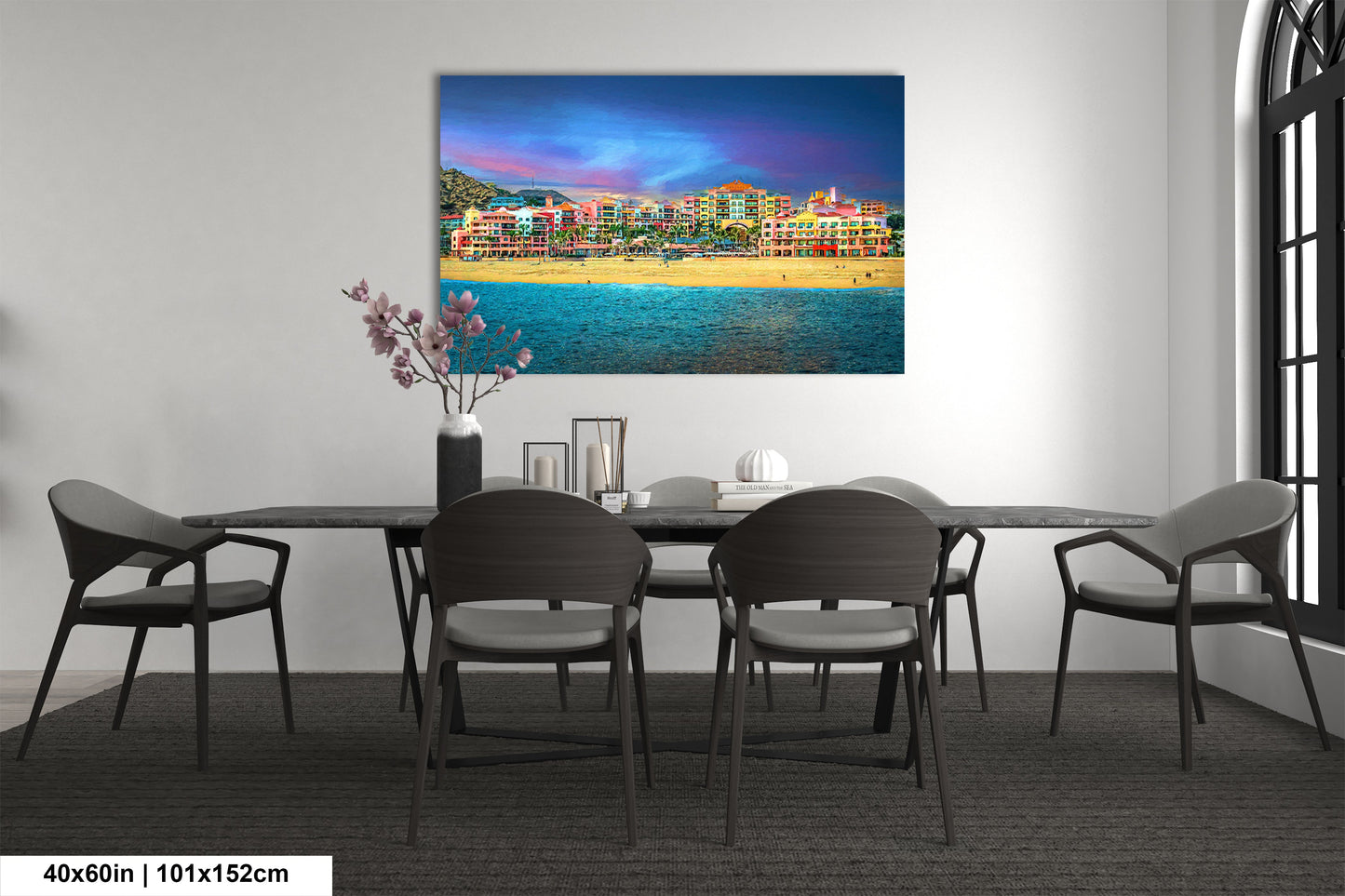 a dining room table with chairs and a painting on the wall