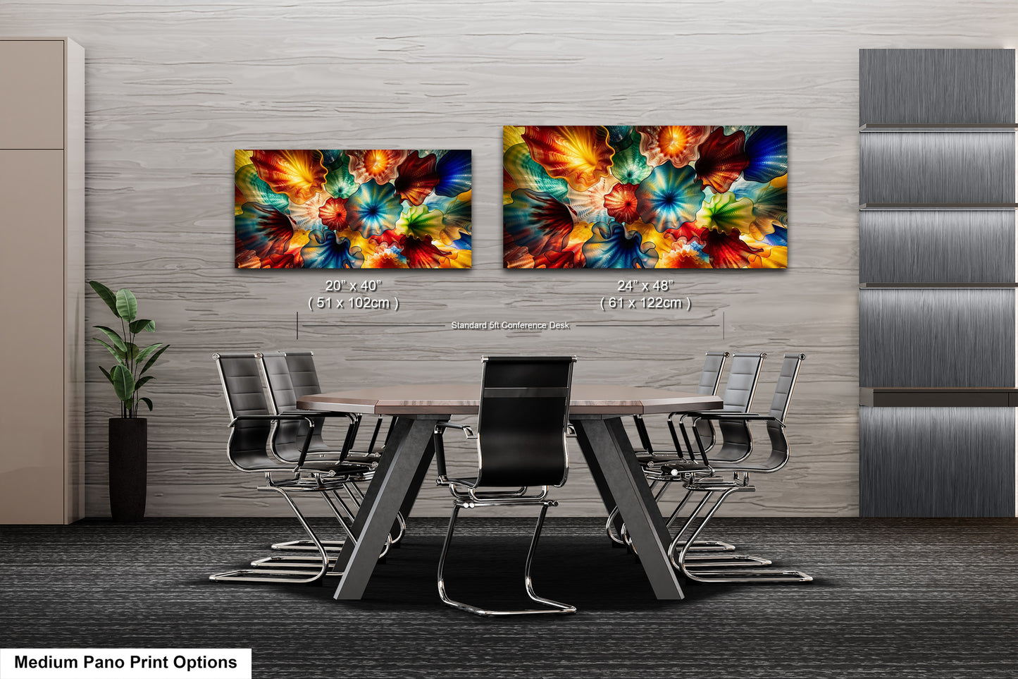 a modern office space with a large, wooden conference table surrounded by black chairs. Two large, colorful paintings are displayed on the wall above the table, creating a vibrant and lively atmosphere.