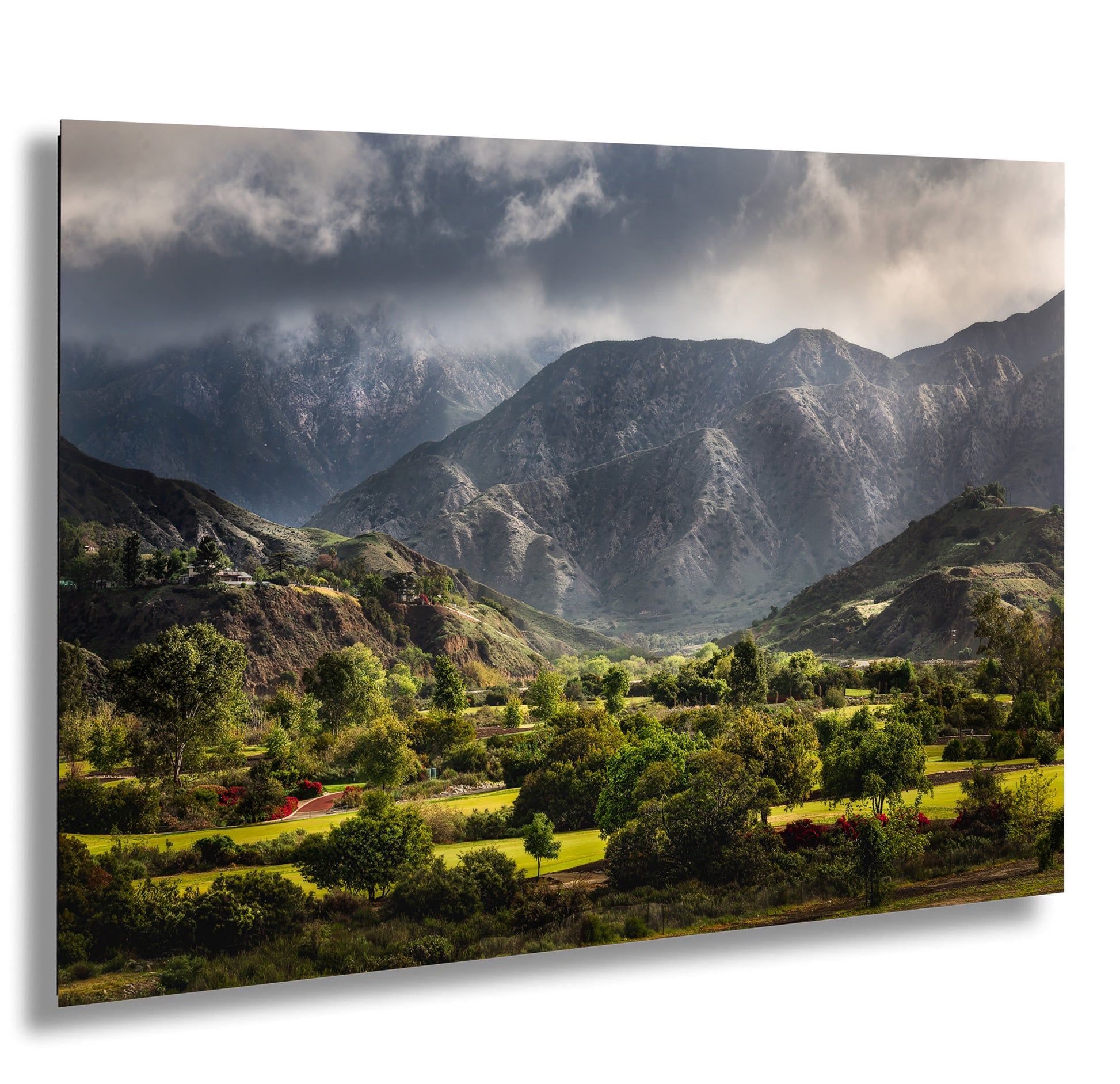 a scenic view of a mountain range under a cloudy sky