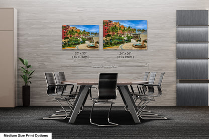 a dining room table with four chairs and a picture of a fountain
