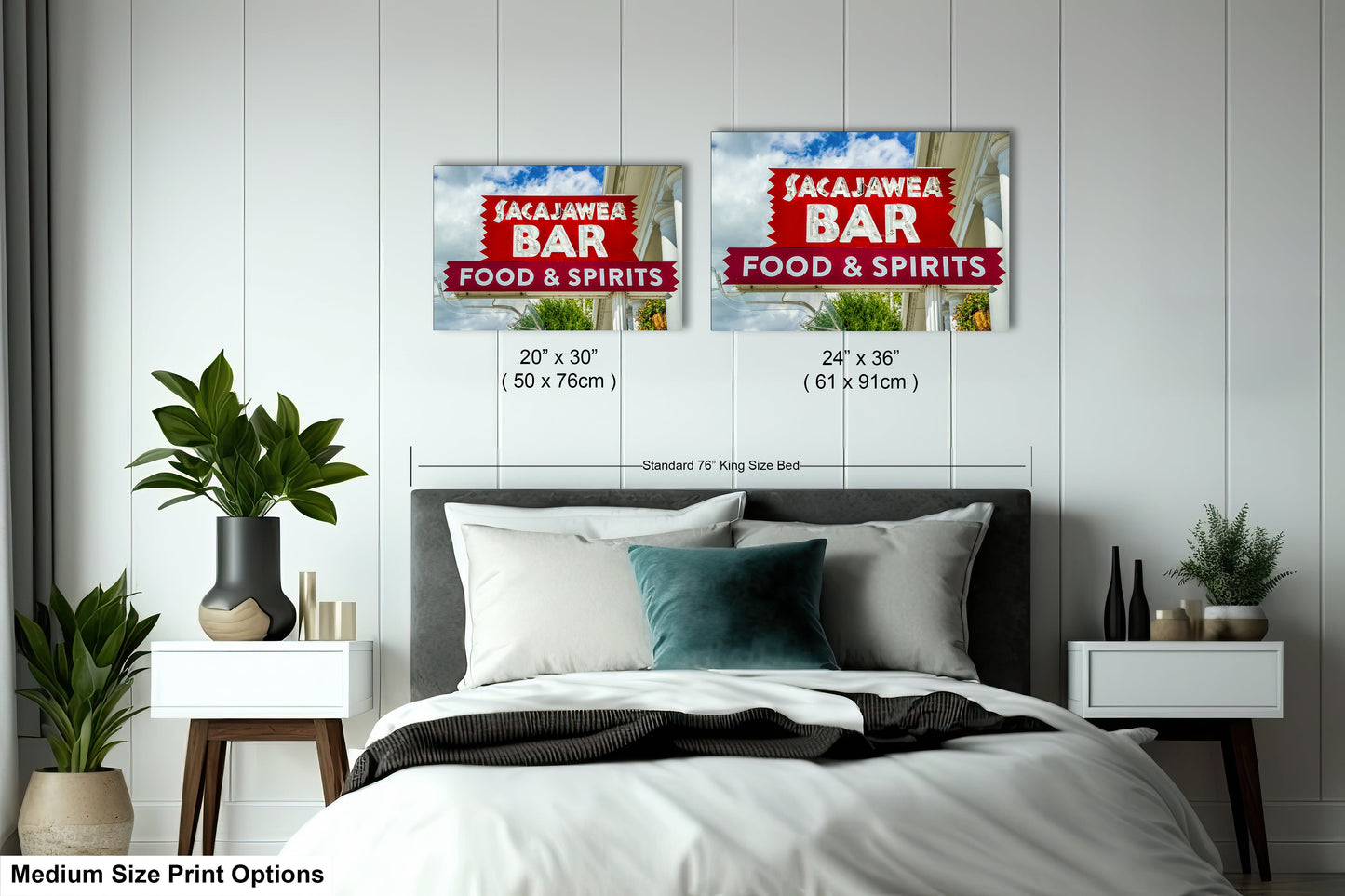 a bed room with a neatly made bed and two posters on the wall