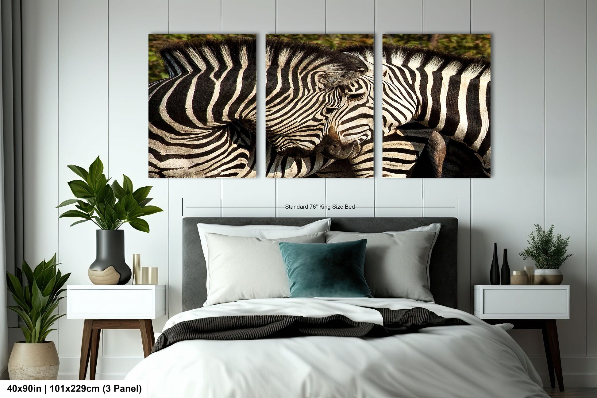 a couple of zebra standing next to each other on a bed