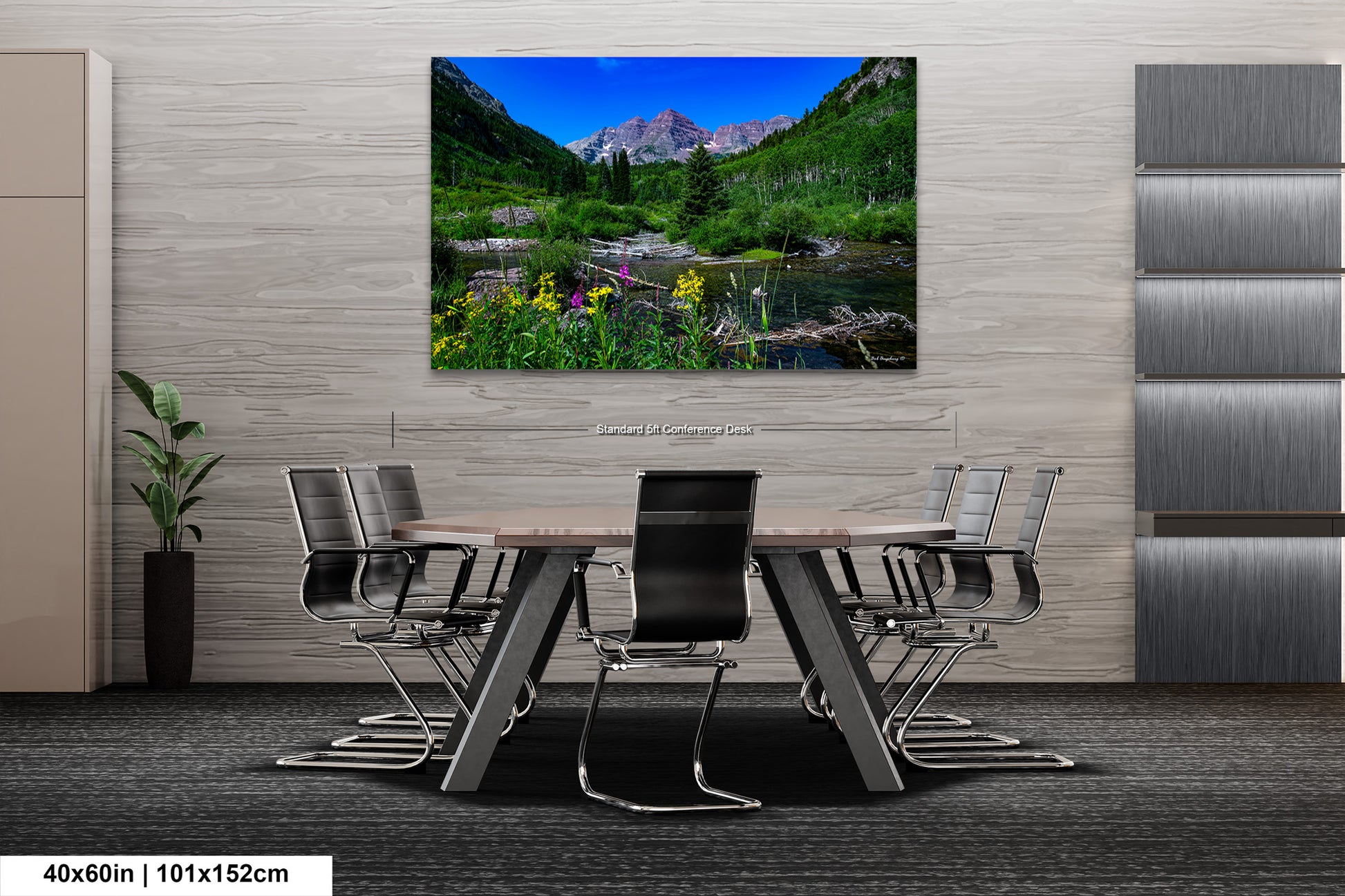 a dining room table with chairs and a painting on the wall