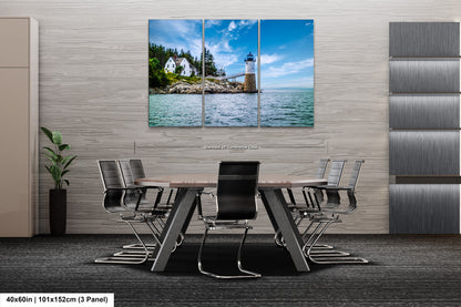 a dining room table with chairs and a lighthouse in the background