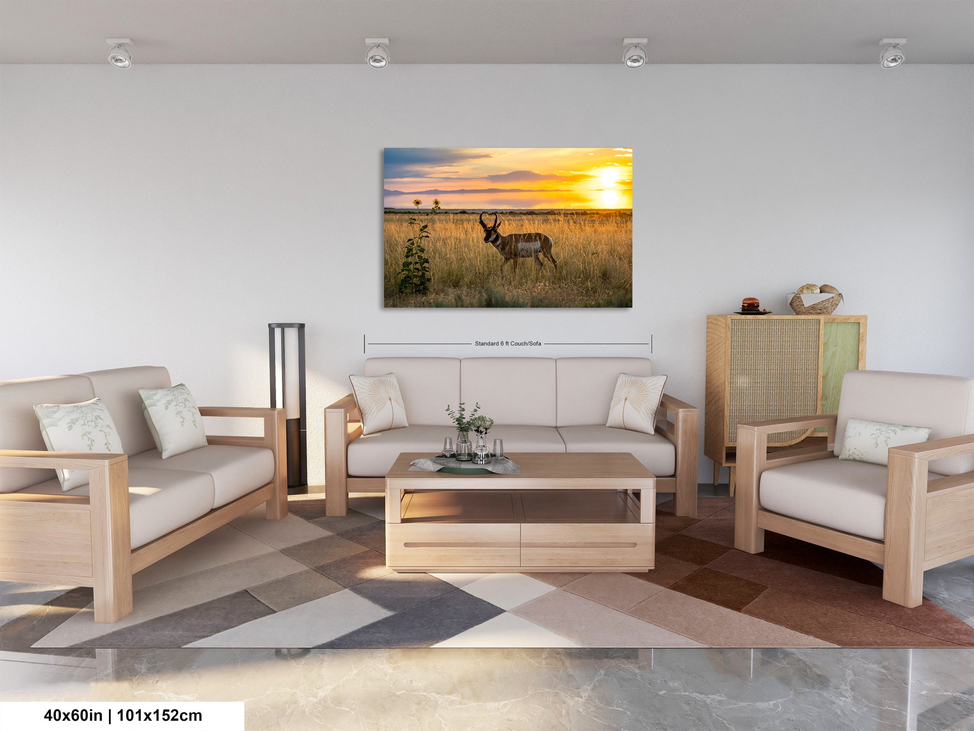 a serene living room with a large, vibrant painting of a sunset over a field hanging on the wall. The painting features a majestic antelope standing in the foreground, adding a touch of wildlife to the scene. The room is furnished with a sofa, two armchairs, and a coffee table, creating a cozy and inviting atmosphere. The overall layout and design of the room suggest a harmonious blend of nature and comfort.