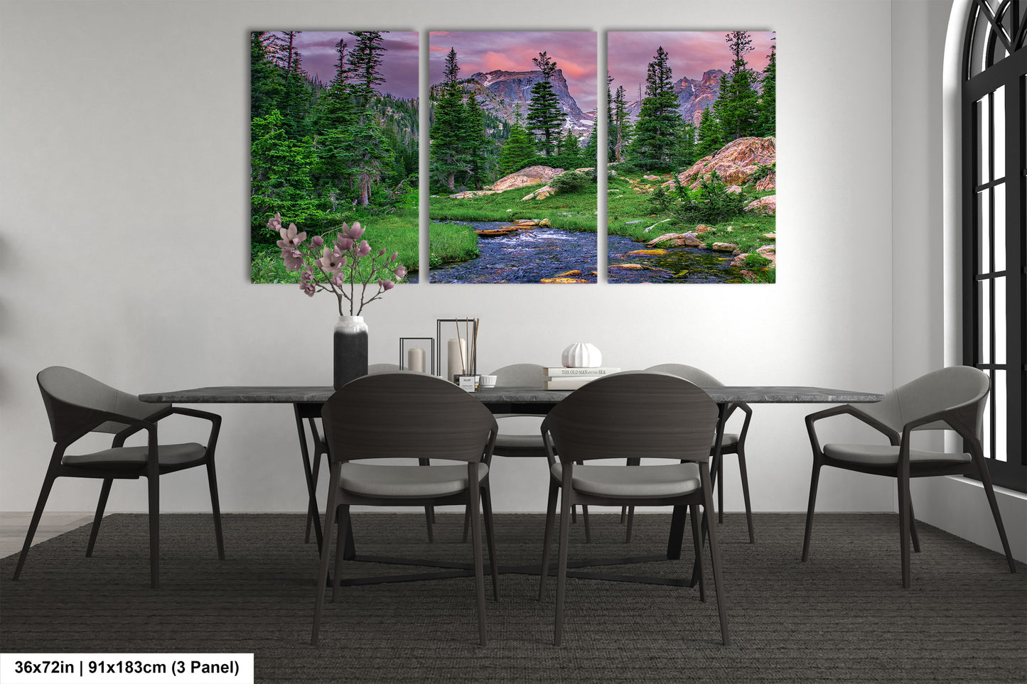 a dining room table with chairs and a painting on the wall
