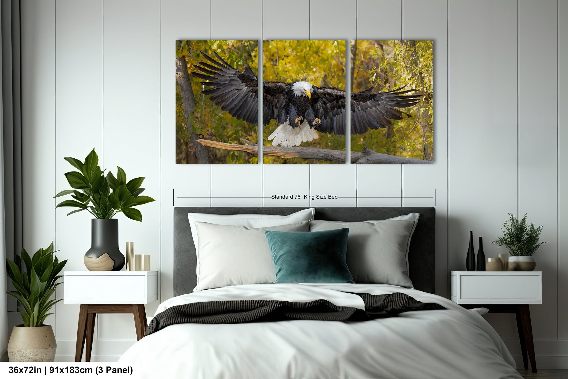 a large black and white bird flying over a bed