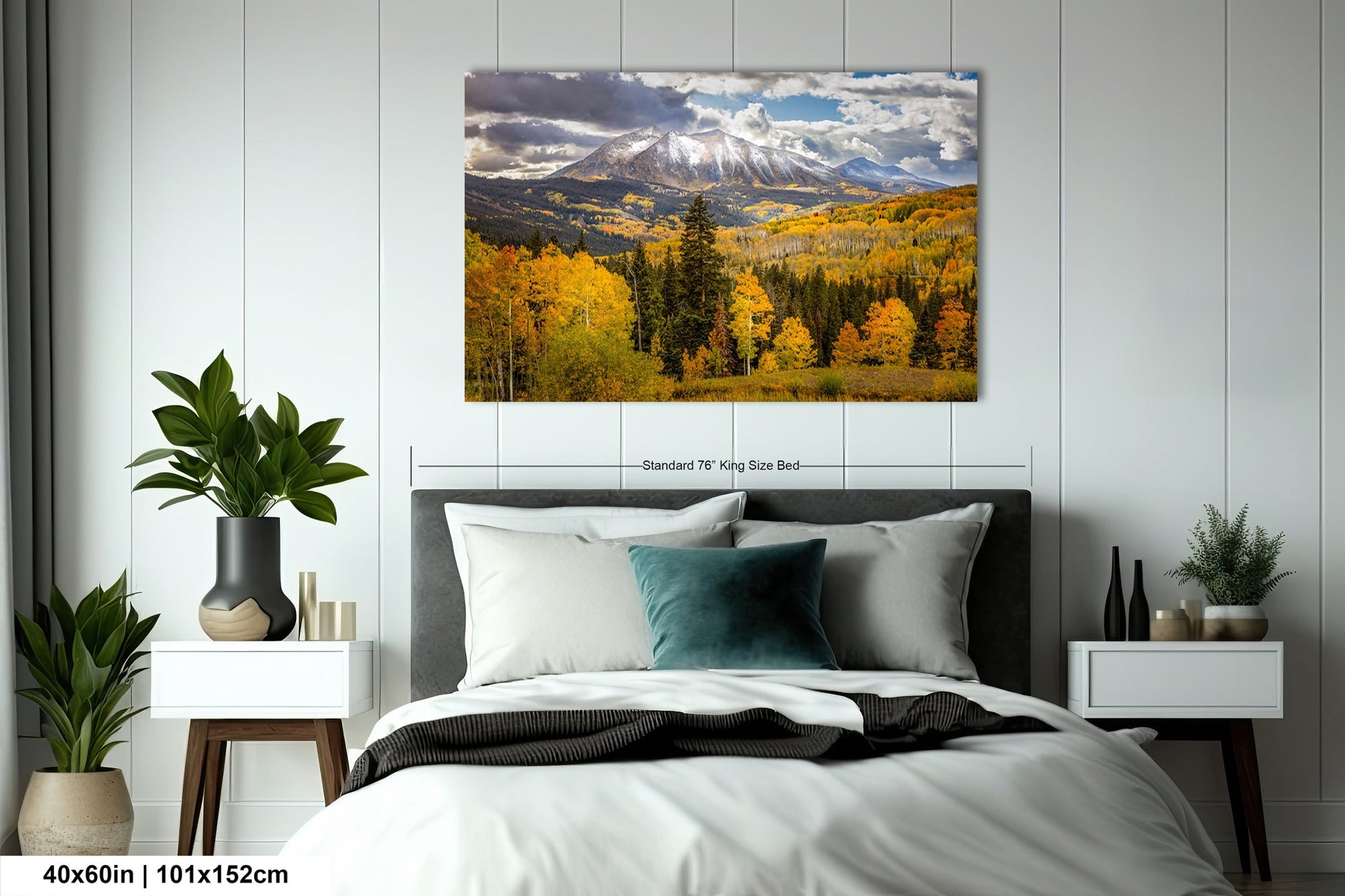 a bedroom with a bed and a painting on the wall