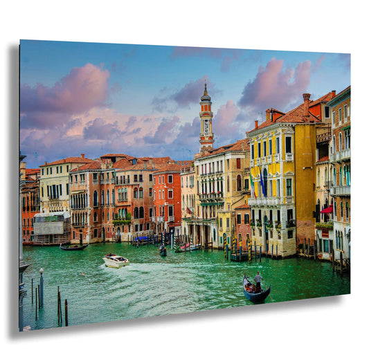 a picture of some buildings and a boat in the water