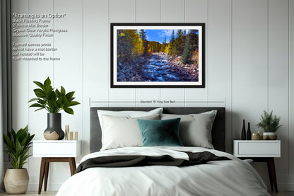 a bedroom with a bed and a picture hanging on the wall