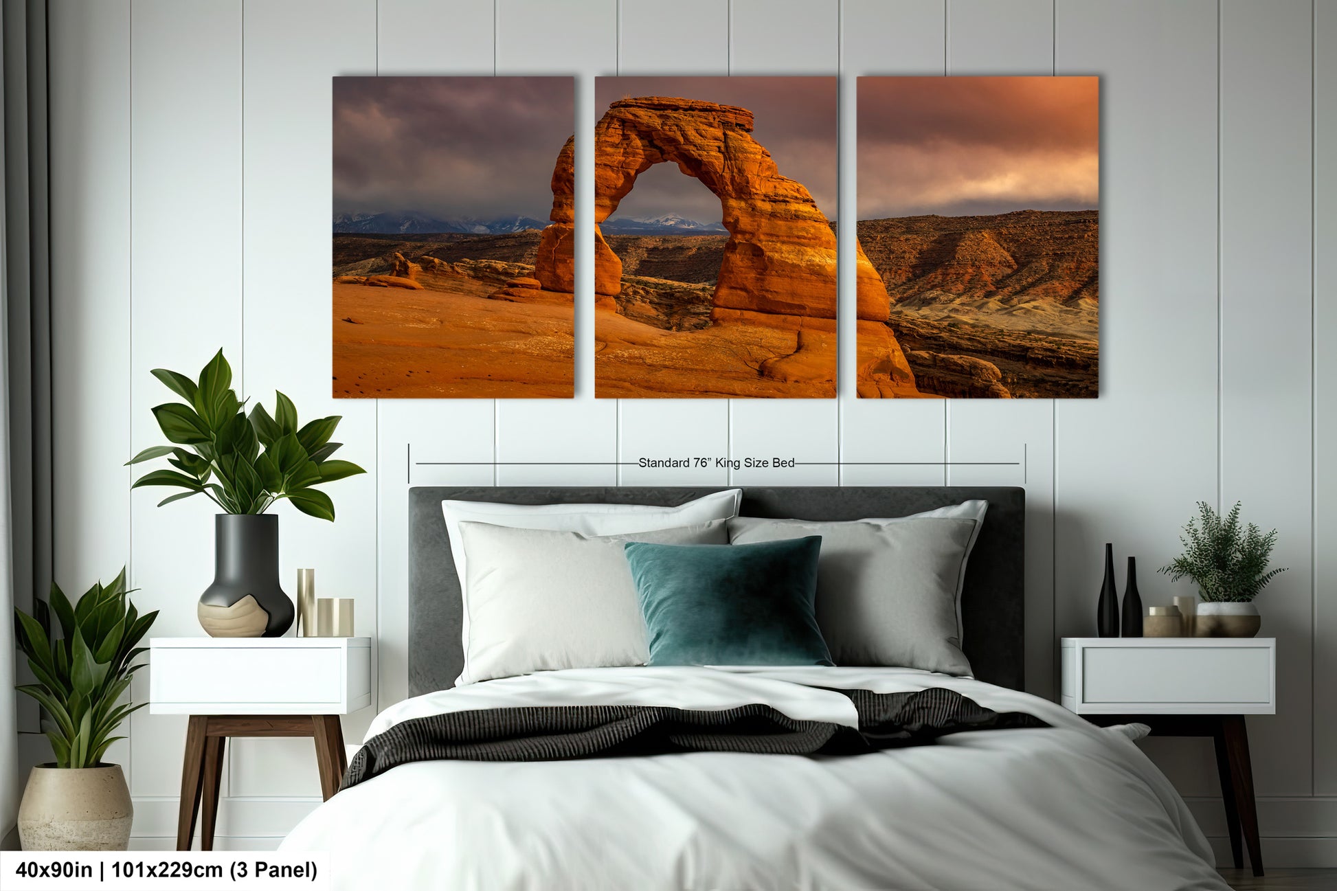 a bed room with a neatly made bed and two pictures on the wall