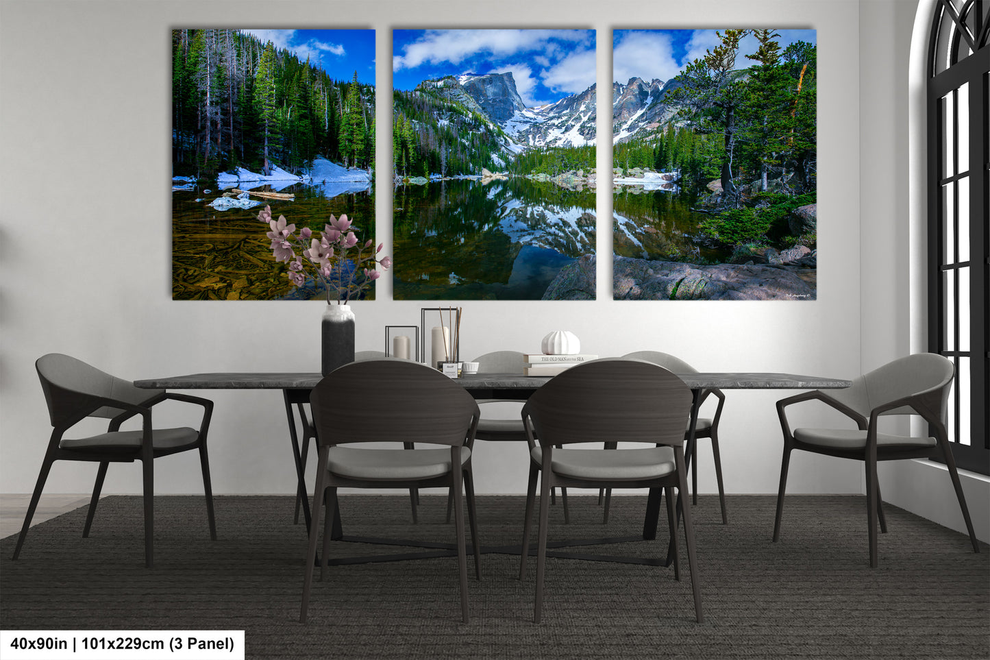 a dining room with a table and four chairs
