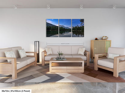 a living room filled with furniture and a painting on the wall