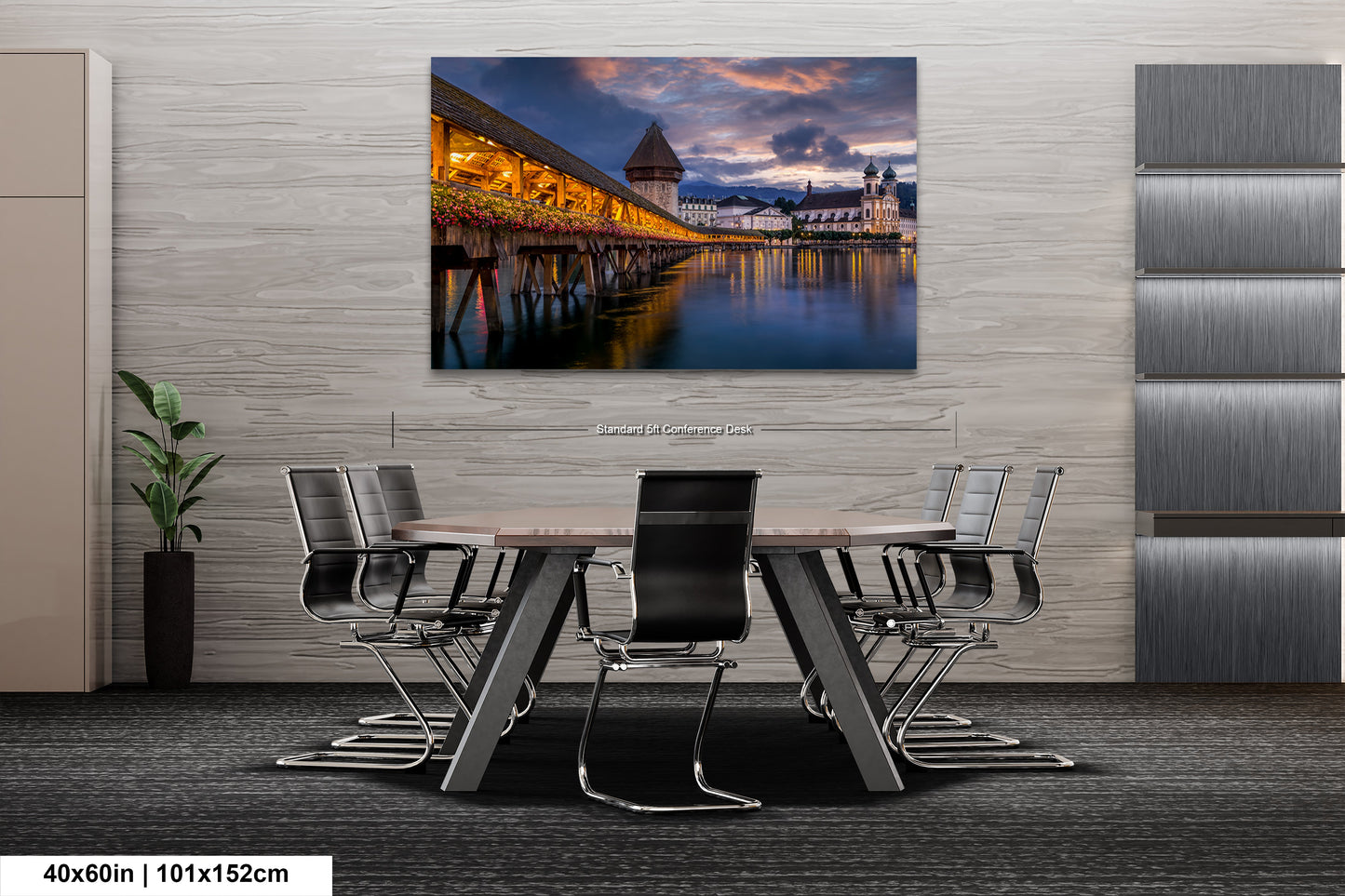 a dining room table with chairs and a painting on the wall