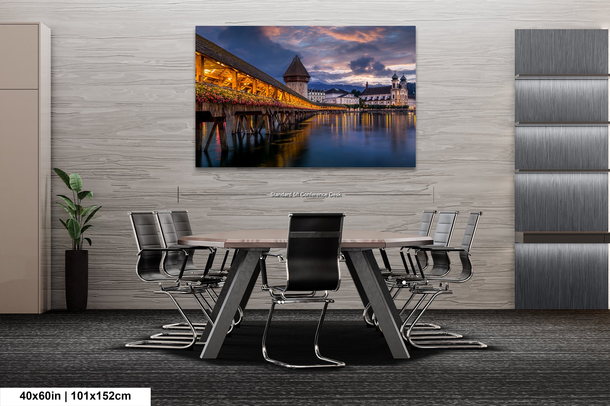 a dining room table with chairs and a painting on the wall