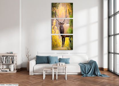 a living room filled with furniture and a painting on the wall