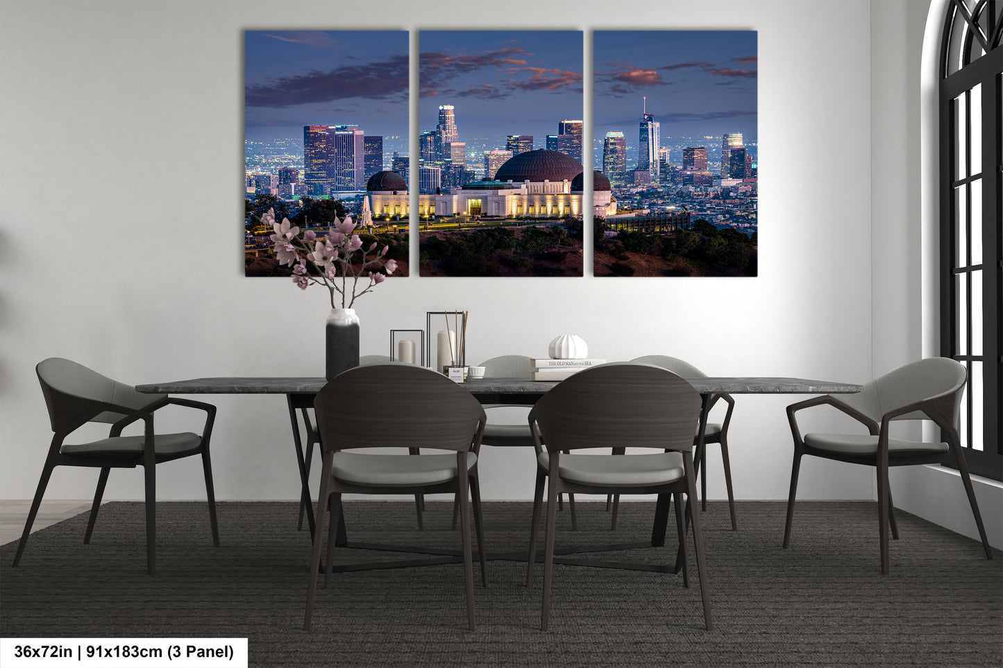 a dining room with a table and chairs with a city skyline in the background