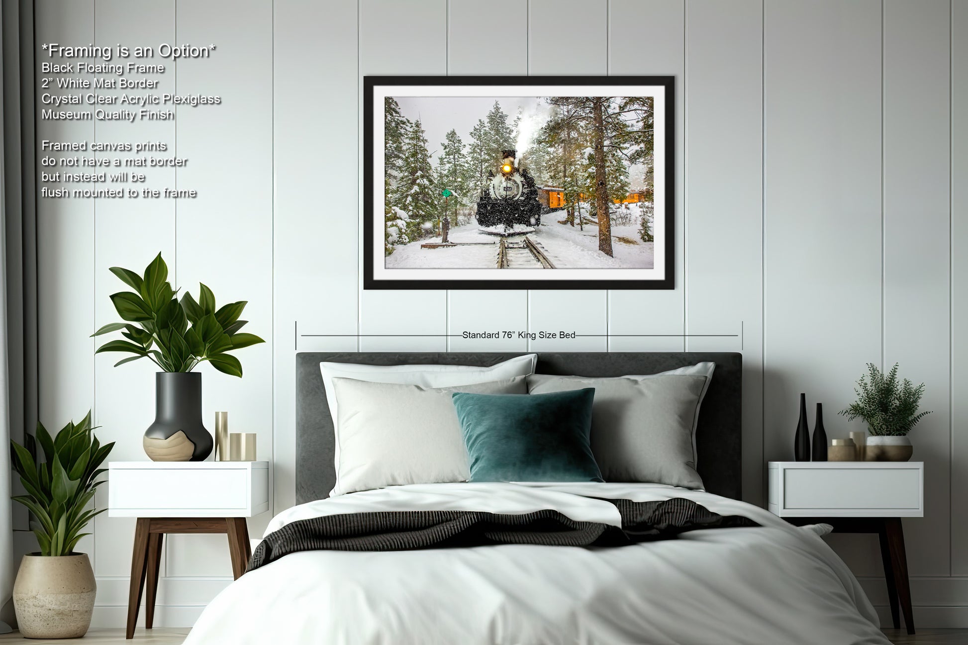 a bedroom with a bed and a picture hanging above it