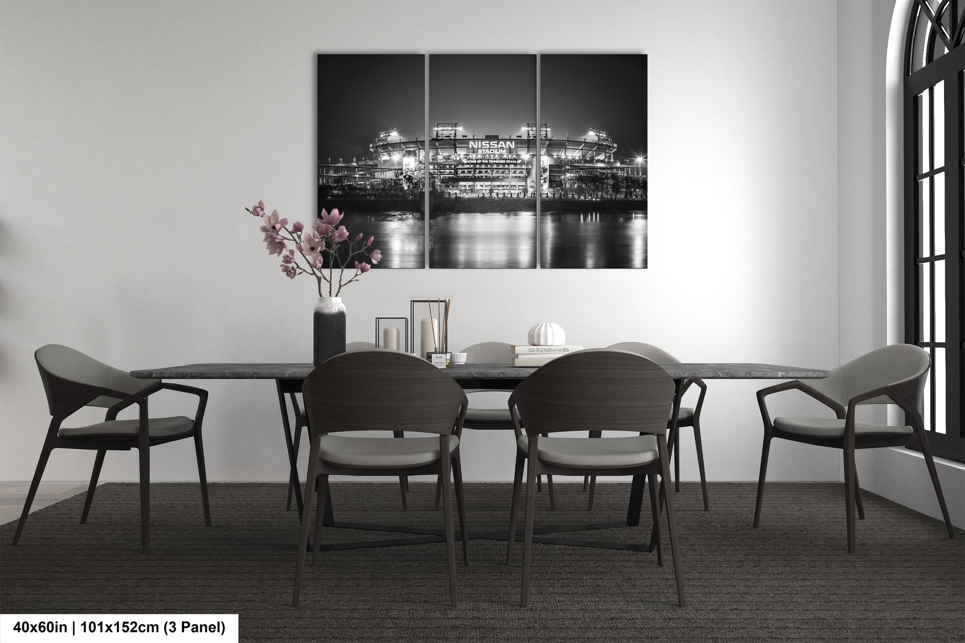 a black and white photo of a dining room table