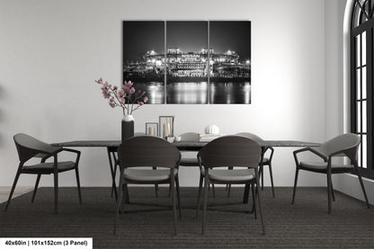 a black and white photo of a dining room table