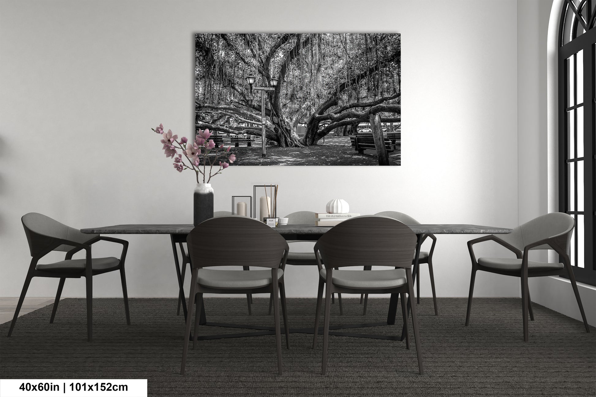 a black and white photo of a dining room table