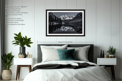a black and white photo of a bedroom