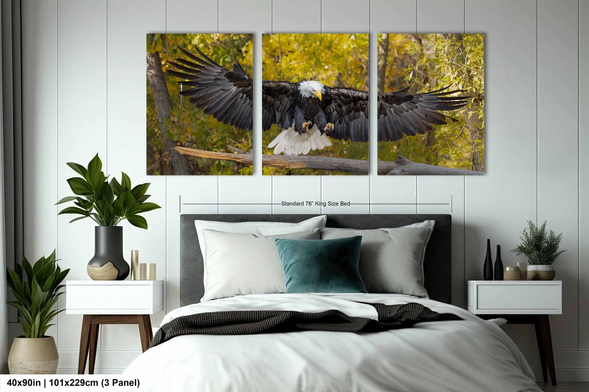 a bedroom with a bed and two paintings on the wall