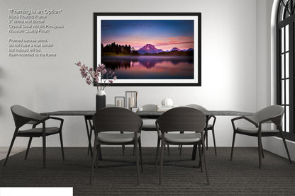 a picture of a dining room with a table and chairs