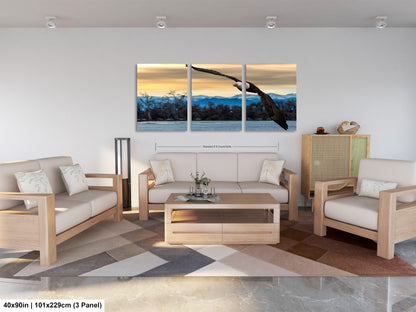 a living room filled with furniture and a painting on the wall