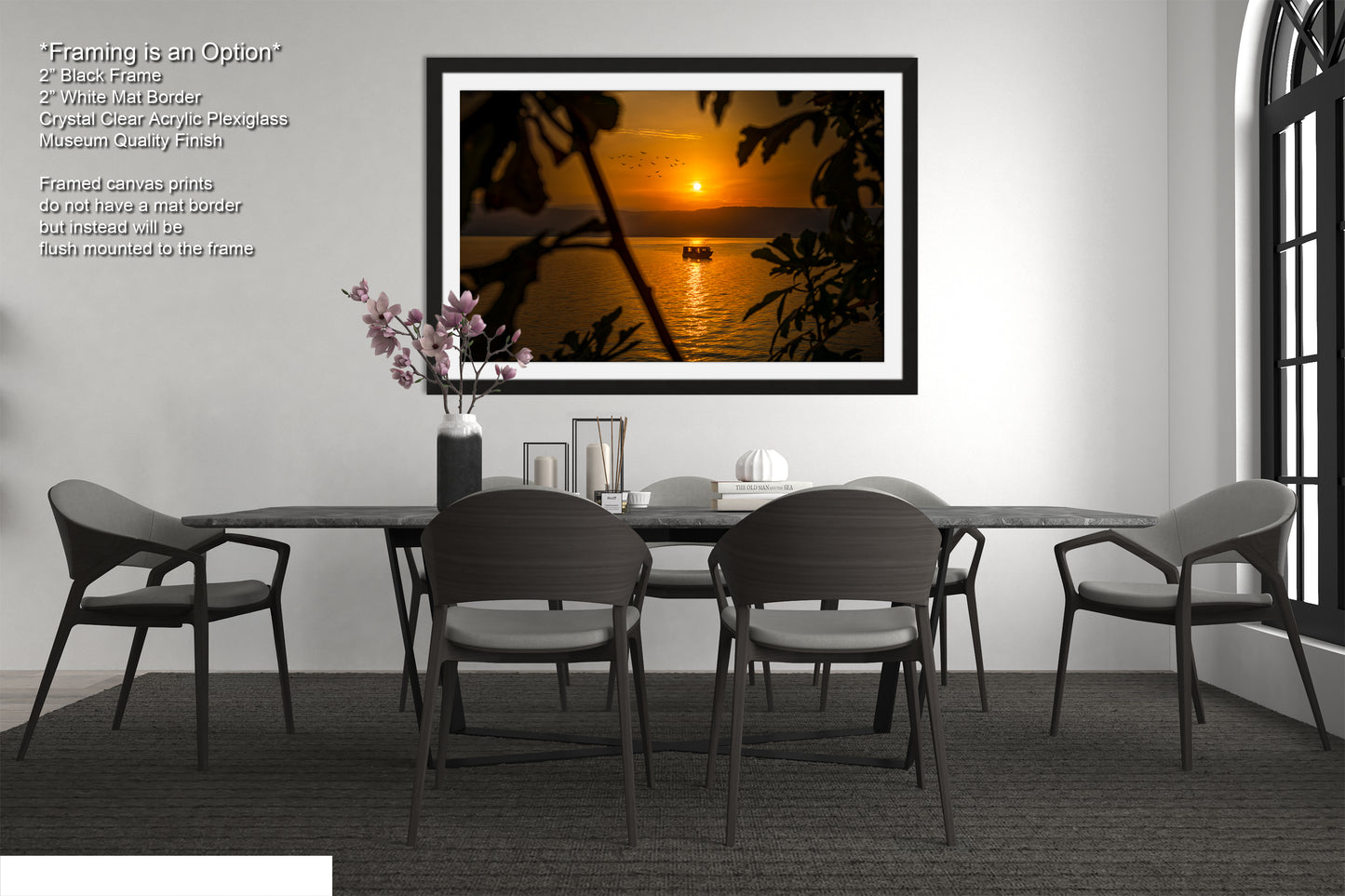 a dining room table with chairs and a vase of flowers