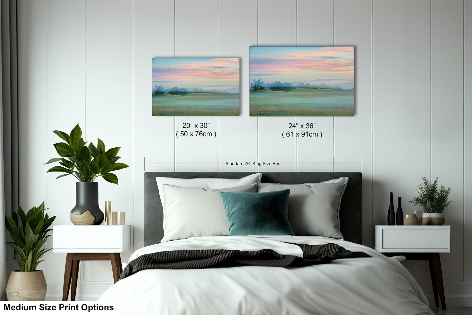 a bed with two paintings on the wall above it