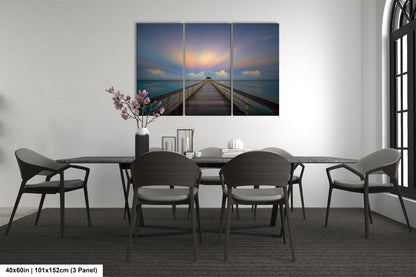 a dining room table with chairs and a painting on the wall