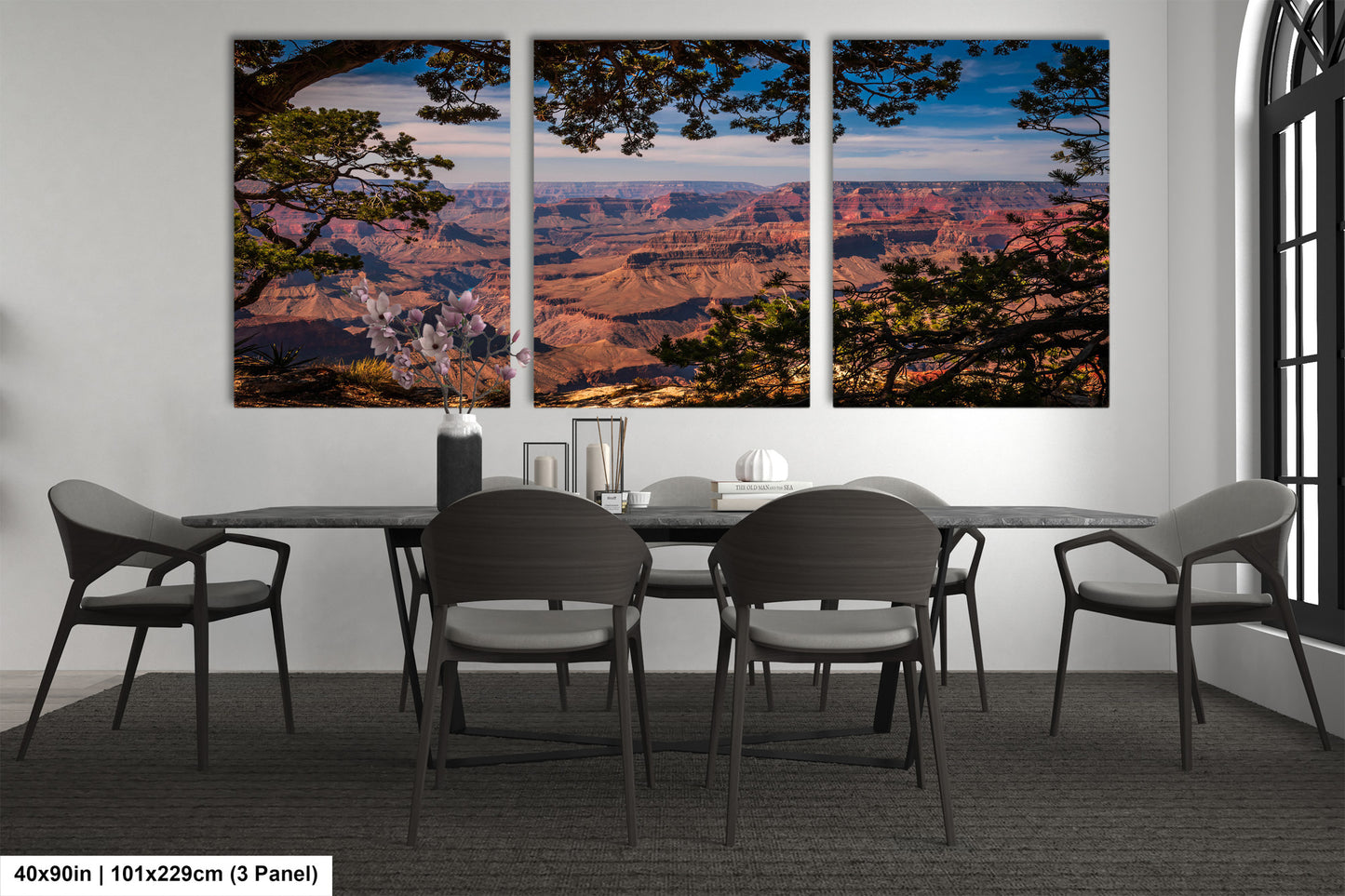 a dining room table with four chairs and a view of the grand canyon