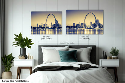 a bedroom with a large bed and a picture of the st louis skyline