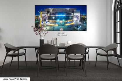 a dining room table with chairs and a vase of flowers