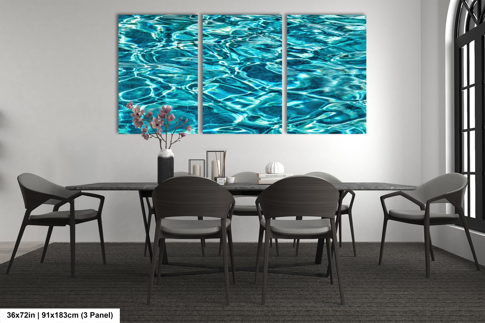 a modern dining room with a large, three-panel artwork depicting a serene water scene on the wall. The artwork is surrounded by a minimalist design, with a black table and chairs, a vase of flowers, and a few decorative items on the table.