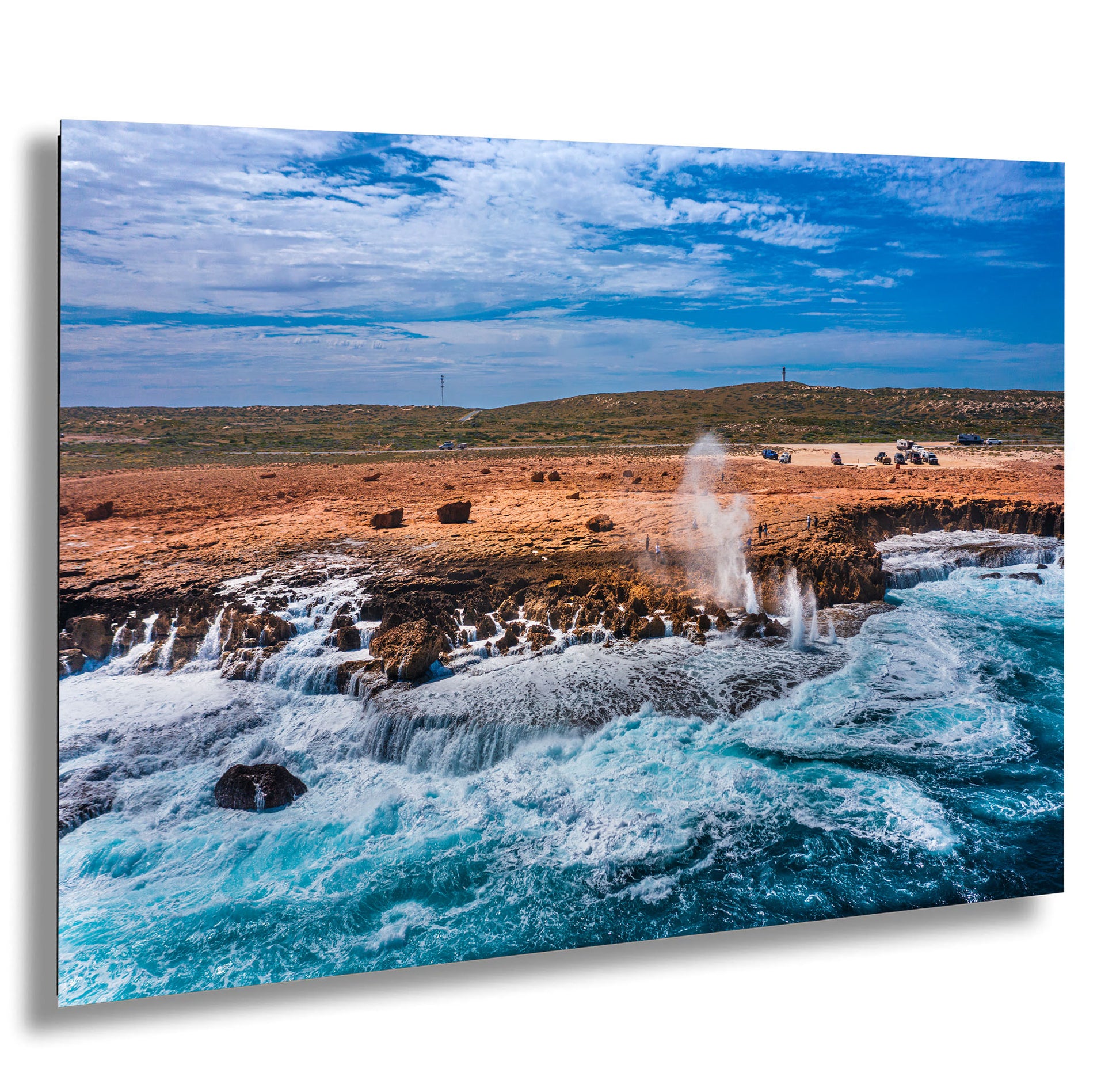 a large body of water near a rocky shore