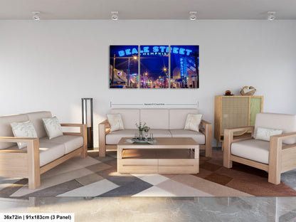 a living room filled with furniture and a painting on the wall